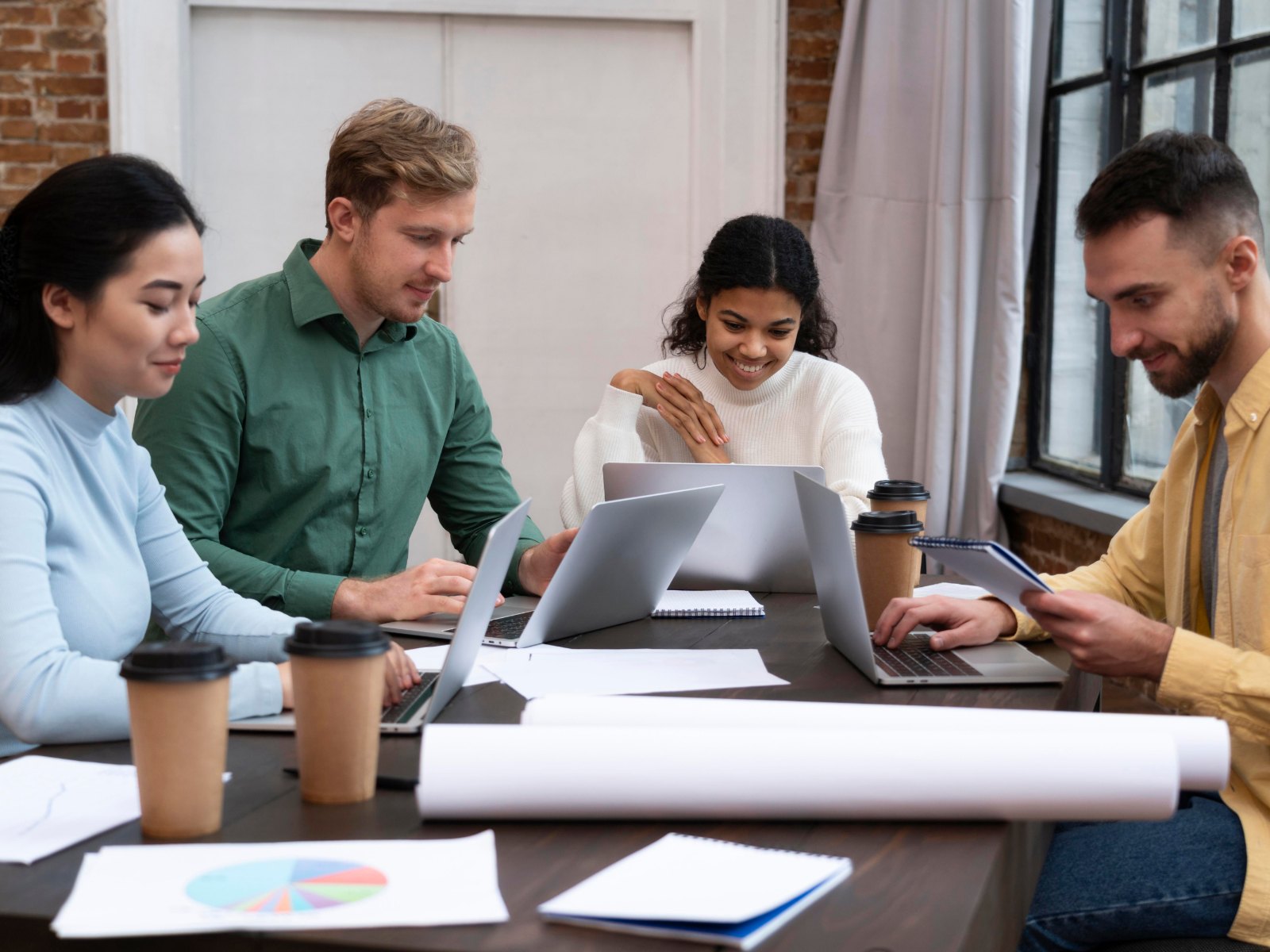The Vivtaa team working together around a table